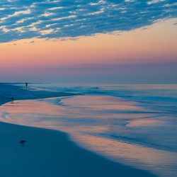 Destin Florida Sunrise Woman walking ahead of me catching a moment